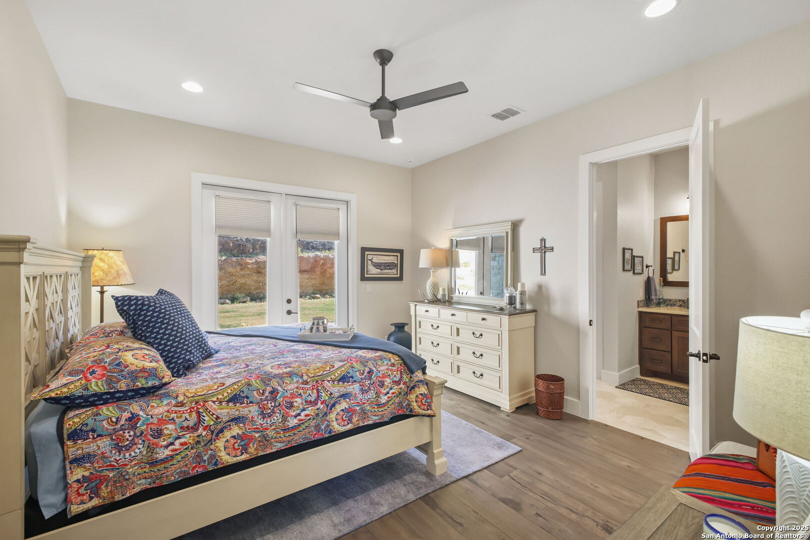 1023 Comanche Ridge New Braunfels, TX 78132 - Photo 41 of 109 a bedroom with a large bed and a window