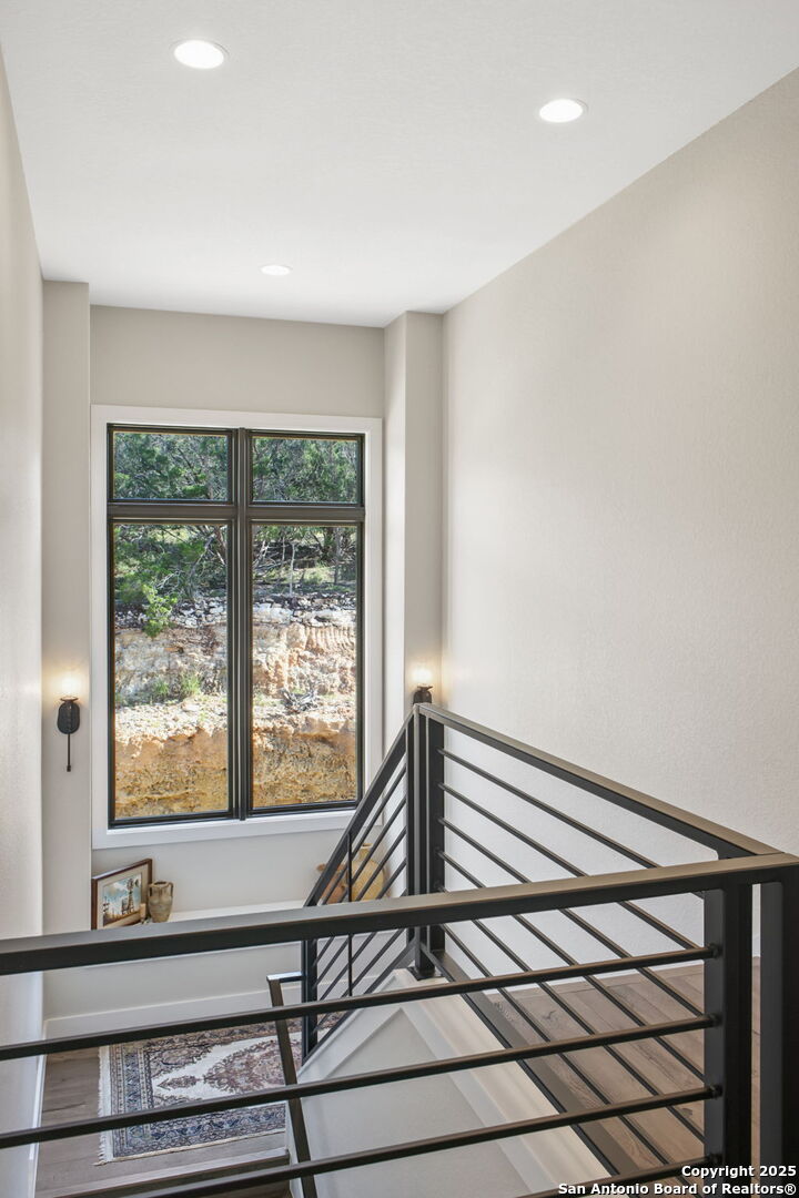1023 Comanche Ridge New Braunfels, TX 78132 - Photo 45 of 109 a view of a room with wooden floor and windows