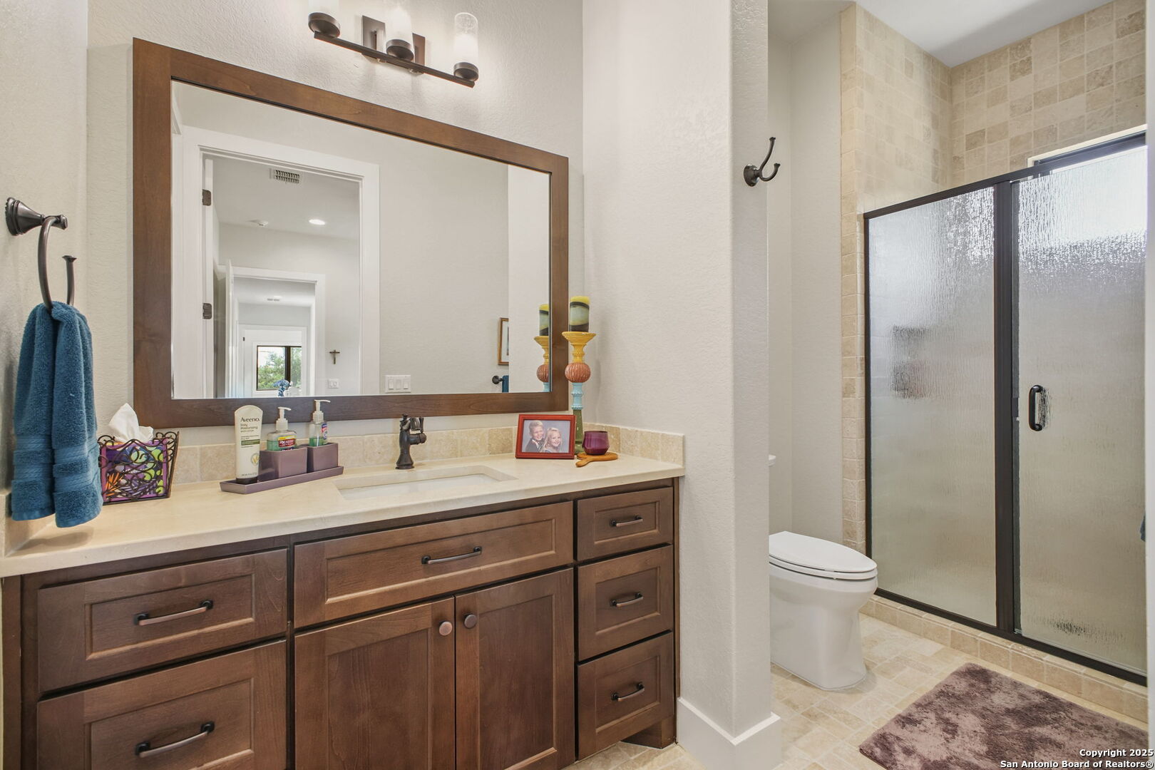 1023 Comanche Ridge New Braunfels, TX 78132 - Photo 52 of 109 a bathroom with a toilet sink and shower