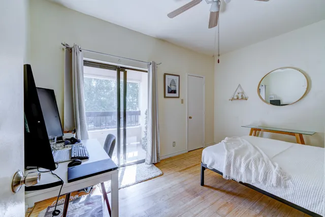 a bedroom with bed and a window