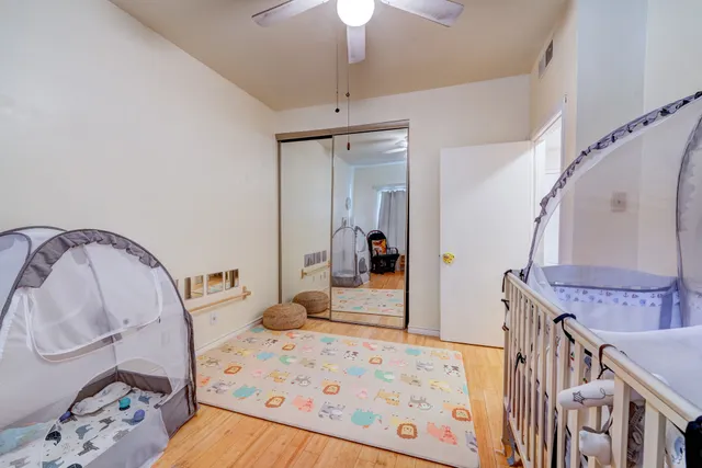 a view of a hallway with a couches and chandelier