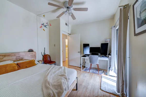 a bed room with a bed and a television