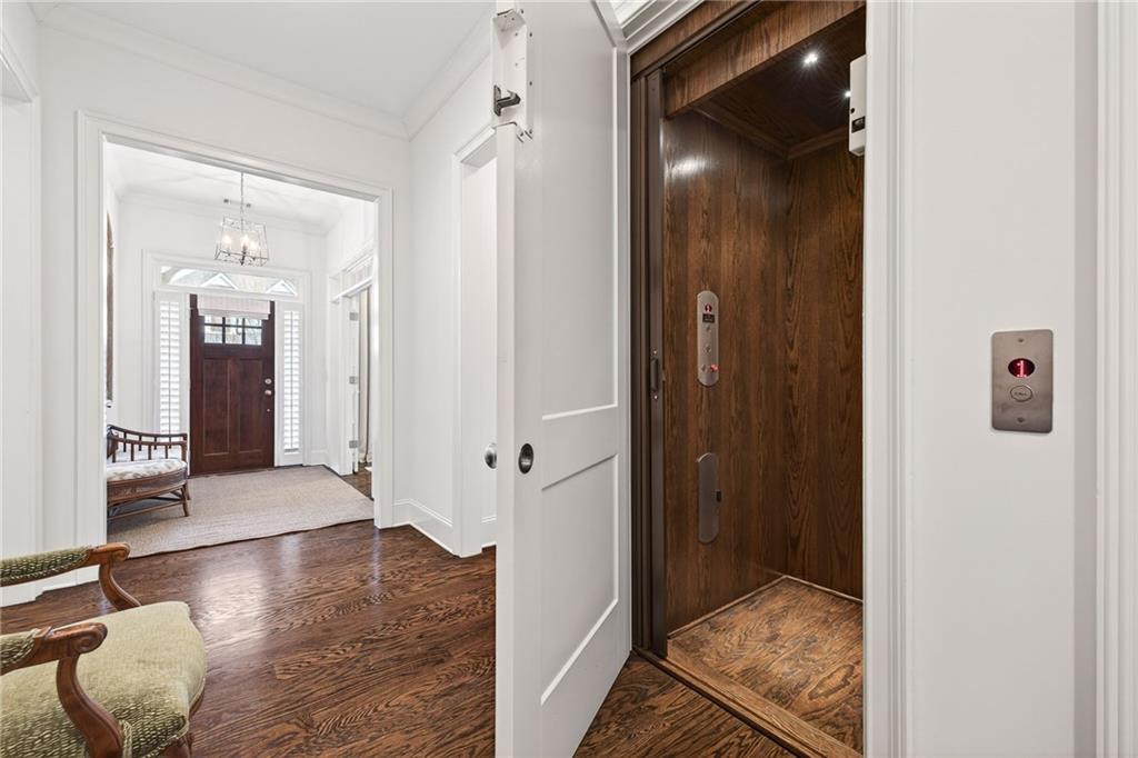 4774 Wieuca Road Northeast Atlanta, GA 30342 - Photo 11 of 52 a view of a hallway with wooden floor and a bathroom