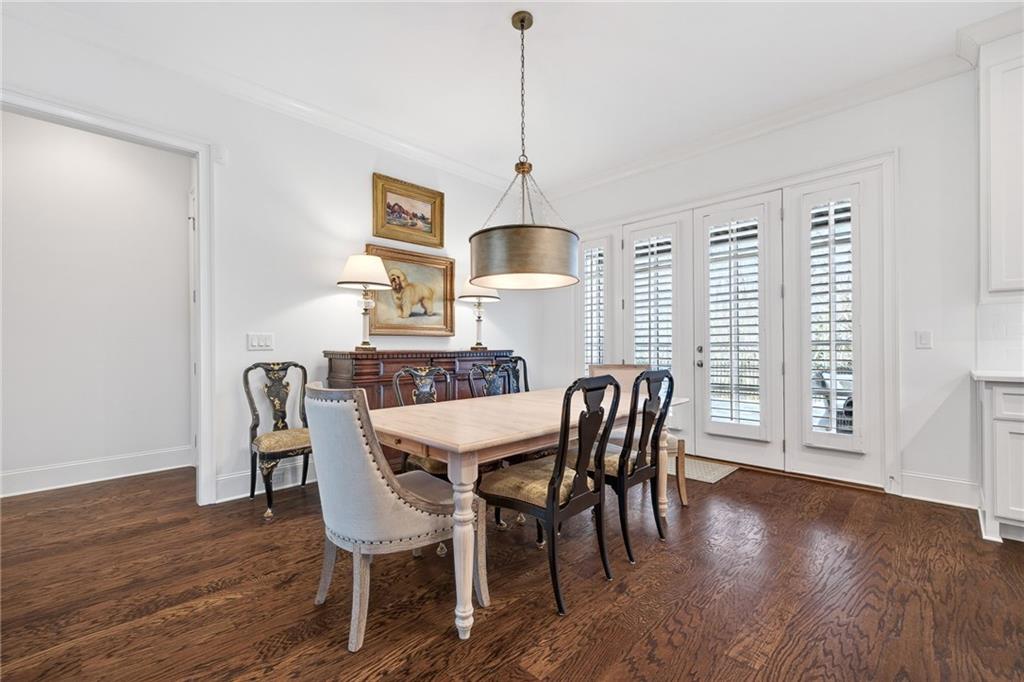 4774 Wieuca Road Northeast Atlanta, GA 30342 - Photo 17 of 52 a dining room with furniture window wooden floor