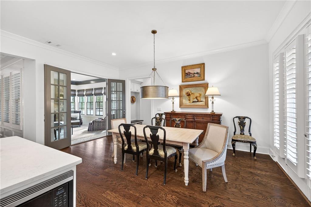 4774 Wieuca Road Northeast Atlanta, GA 30342 - Photo 18 of 52 a view of a dining room with furniture window and wooden floor