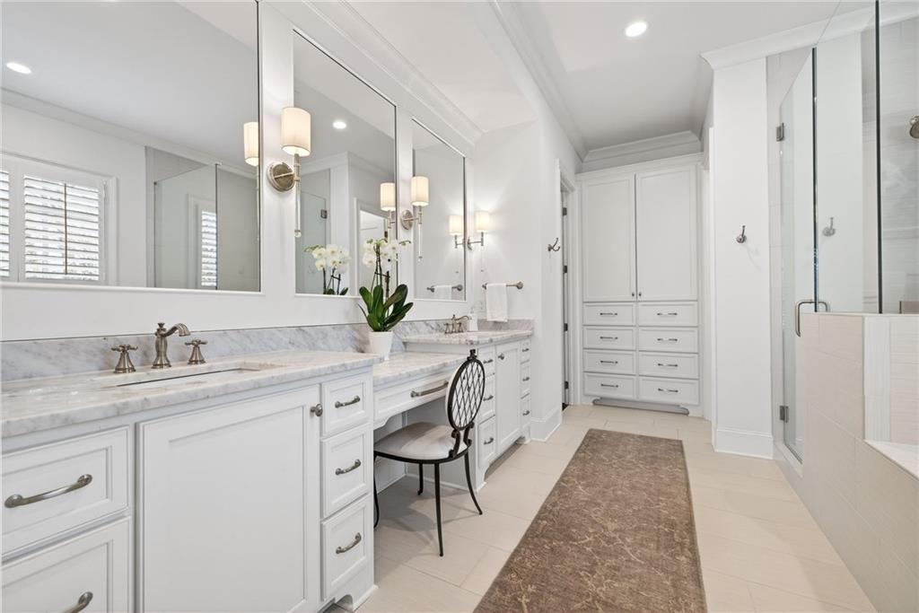 4774 Wieuca Road Northeast Atlanta, GA 30342 - Photo 23 of 52 a spacious bathroom with a granite countertop sink and a mirror
