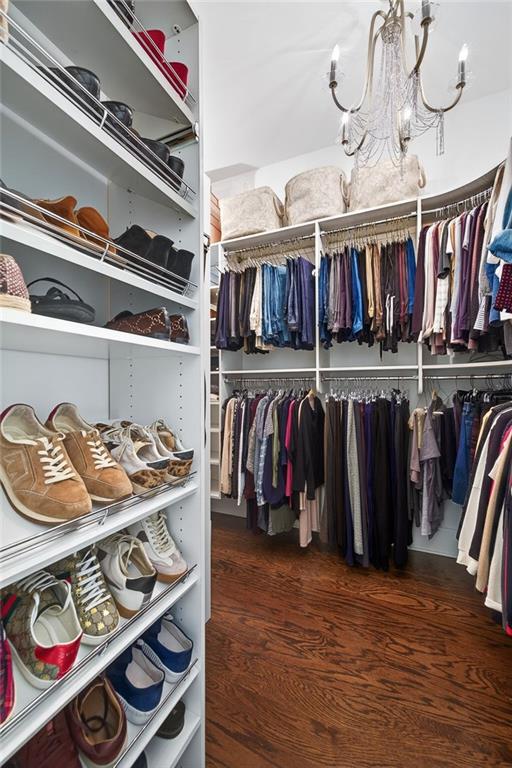 4774 Wieuca Road Northeast Atlanta, GA 30342 - Photo 25 of 52 a view of walk in closet with clothes and shoes