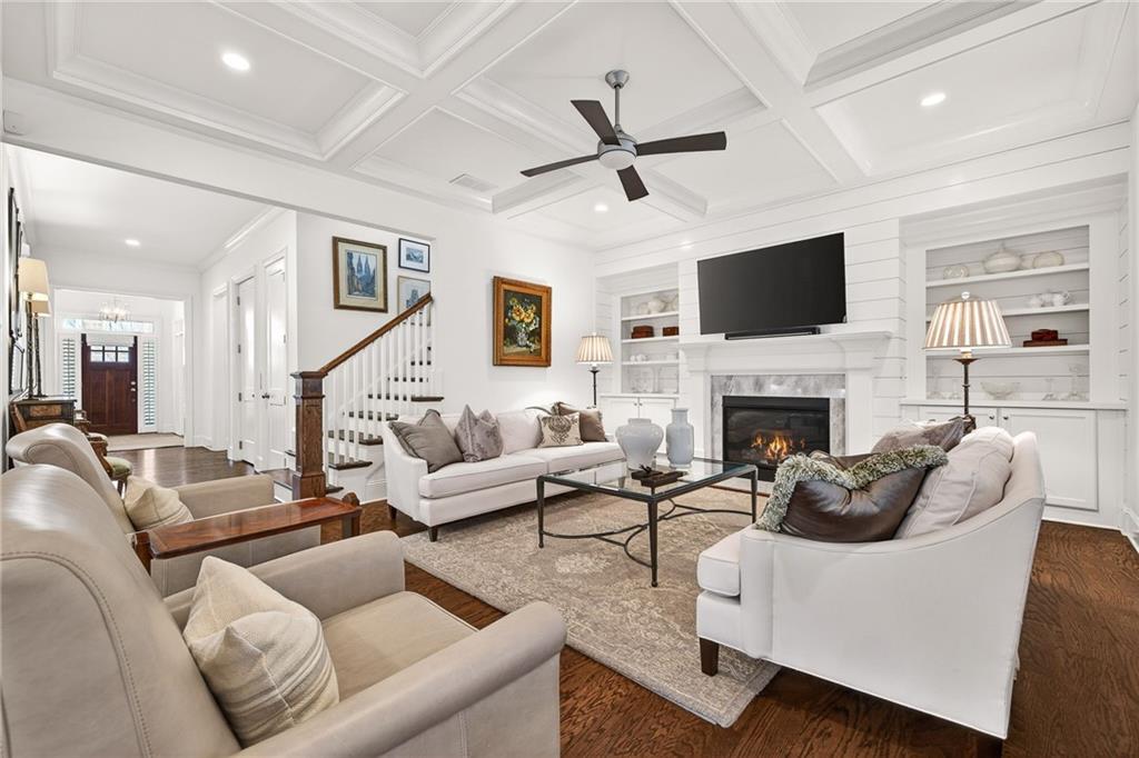 4774 Wieuca Road Northeast Atlanta, GA 30342 - Photo 3 of 52 a living room with furniture a fireplace and a flat screen tv