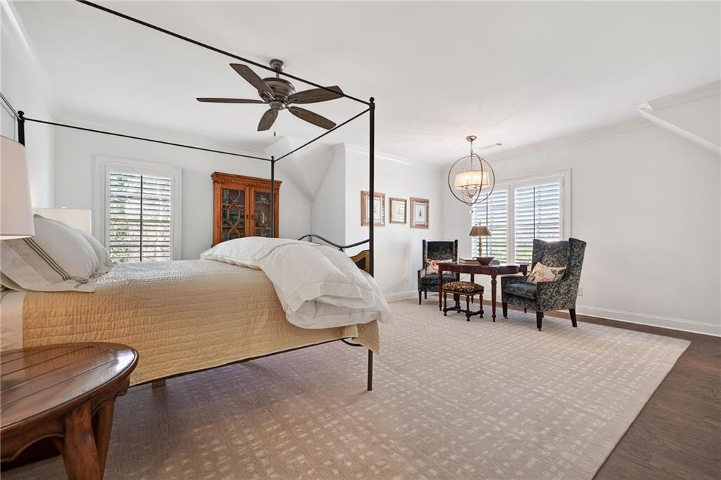 4774 Wieuca Road Northeast Atlanta, GA 30342 - Photo 31 of 52 a bedroom with furniture and a large window