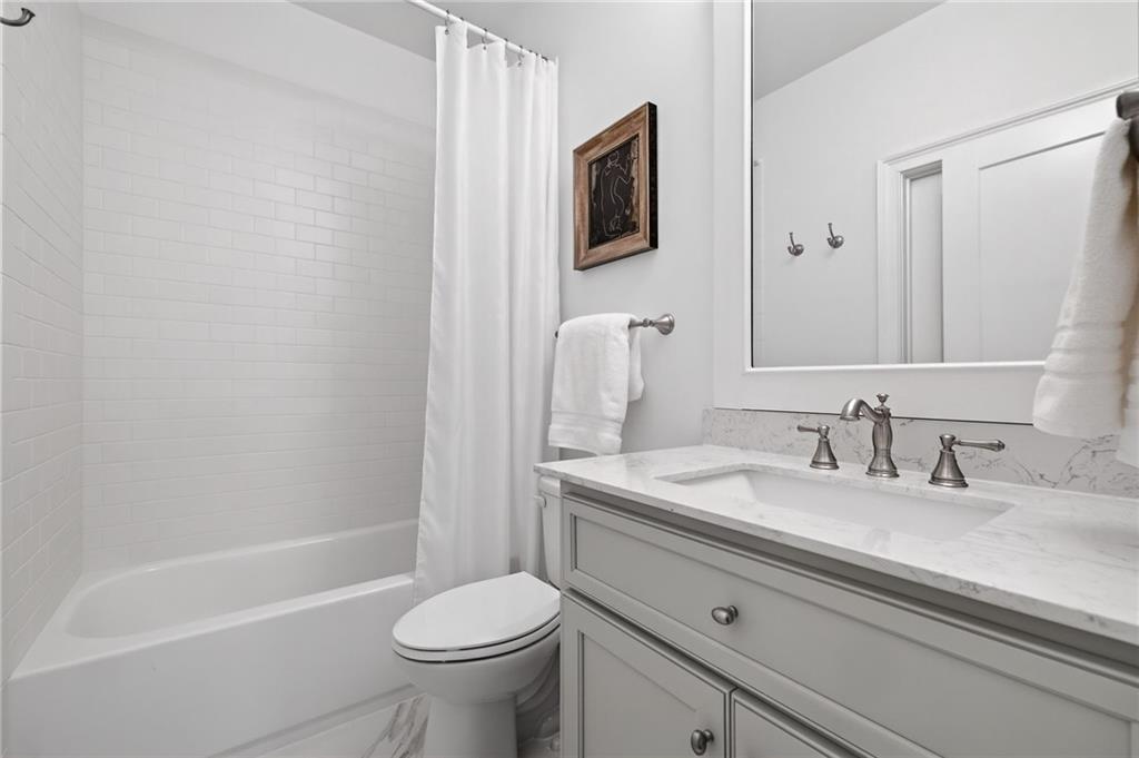 4774 Wieuca Road Northeast Atlanta, GA 30342 - Photo 32 of 52 a bathroom with a sink a toilet and a bathtub