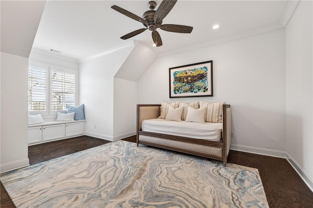 4774 Wieuca Road Northeast Atlanta, GA 30342 - Photo 36 of 52 a spacious bedroom with a bed and a window