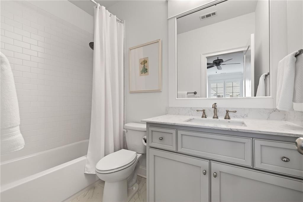4774 Wieuca Road Northeast Atlanta, GA 30342 - Photo 37 of 52 a bathroom with a sink toilet and shower