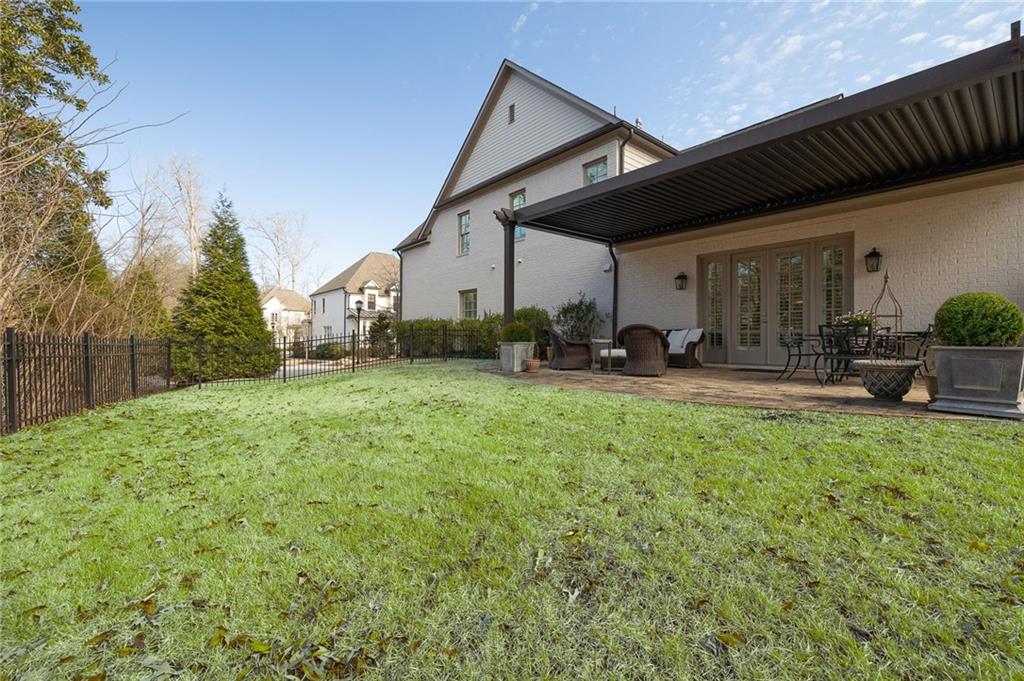 4774 Wieuca Road Northeast Atlanta, GA 30342 - Photo 39 of 52 a swimming pool with outdoor seating and yard