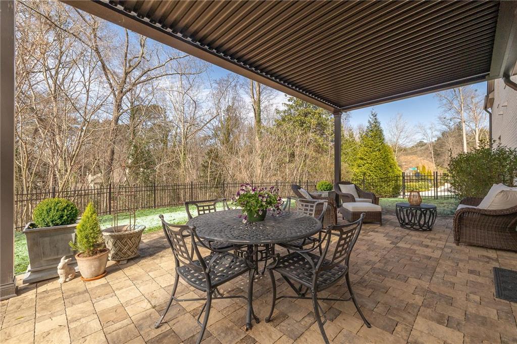4774 Wieuca Road Northeast Atlanta, GA 30342 - Photo 6 of 52 a view of an outdoor sitting area with furniture and wooden floor
