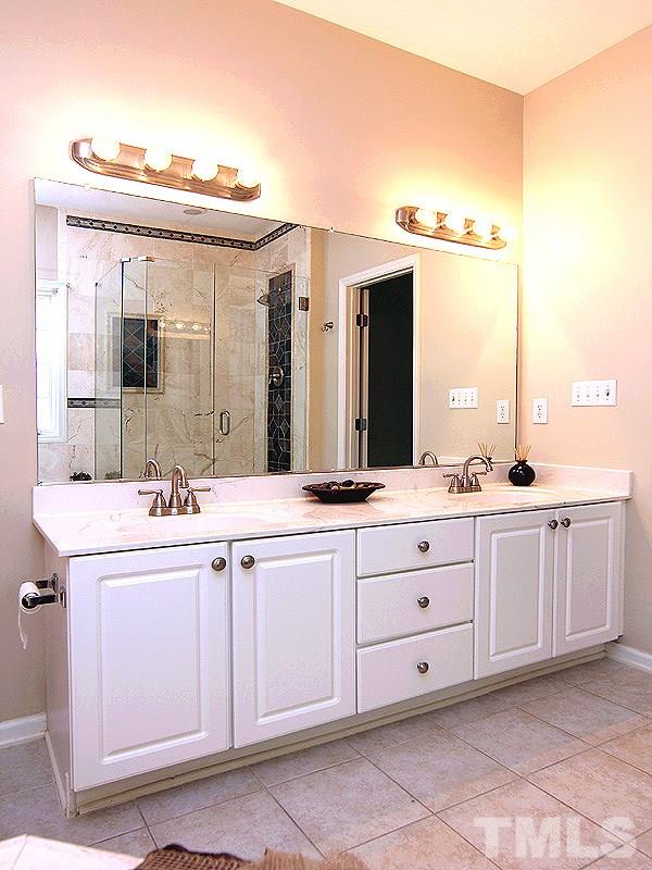 8718 Harps Mill Road Raleigh, NC 27615 - Photo 10 of 22 Lots of Room for Getting Ready in this Master Bath and Spa. PLUS A Perfect Setting for an end of day Retreat....soak your stress away !