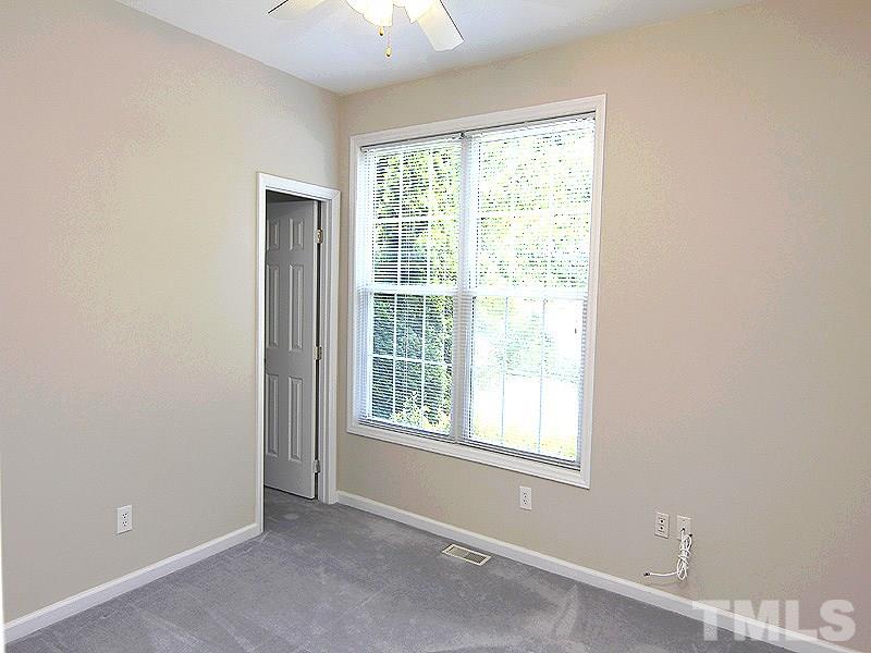 8718 Harps Mill Road Raleigh, NC 27615 - Photo 12 of 22 Great Secondary Bedroom with Ceiling Fan and Walk in Closet.