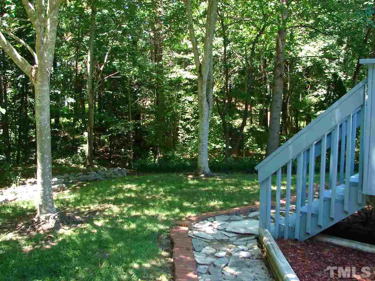 8718 Harps Mill Road Raleigh, NC 27615 - Photo 17 of 22 Walkways, Woods and Professionally Landscape Brings it all to this Setting...