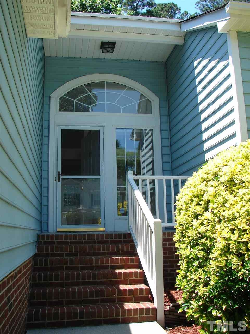 8718 Harps Mill Road Raleigh, NC 27615 - Photo 2 of 22 Greet Your Friends and Family at this Inviting Covered Porch Entrance.