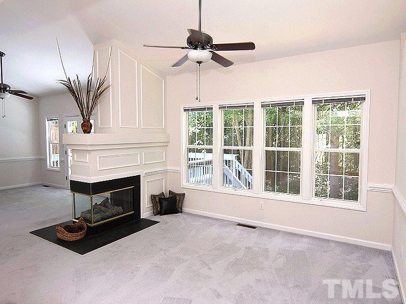 8718 Harps Mill Road Raleigh, NC 27615 - Photo 22 of 22 Open Floor Plan Concept with Shared Two Sided Gas Fireplace between Family Room and Living Room. Great for Entertaining...
