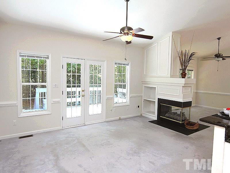 8718 Harps Mill Road Raleigh, NC 27615 - Photo 3 of 22 Enjoy the Wall of Windows View to the Wooded Buffer Backyard View from anywhere in the Main Living area.