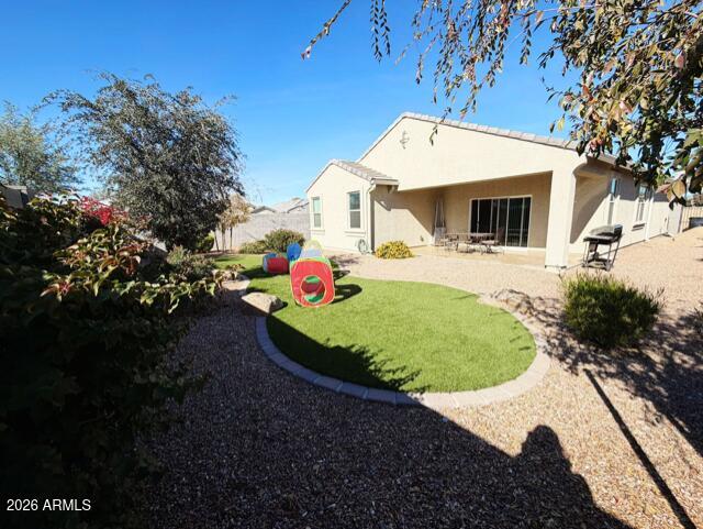 7851 West Riverside Avenue Phoenix, AZ 85043 - Photo 29 of 40 a front view of a house with a yard