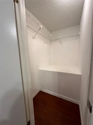 a view of an empty walk in closet