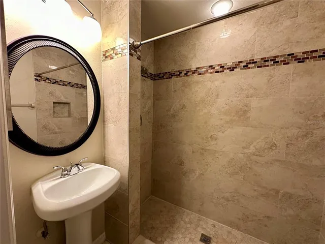a bathroom with a sink and a mirror