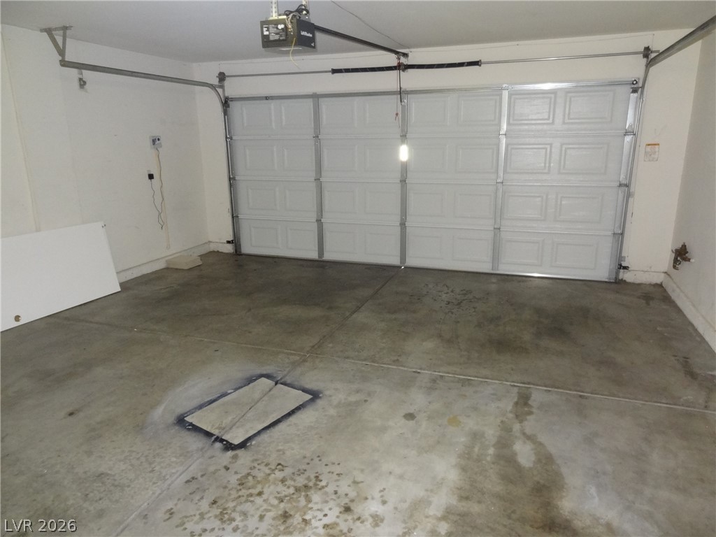 1199 Sunfire Street Henderson, NV 89014 - Photo 10 of 11 Garage featuring a garage door opener