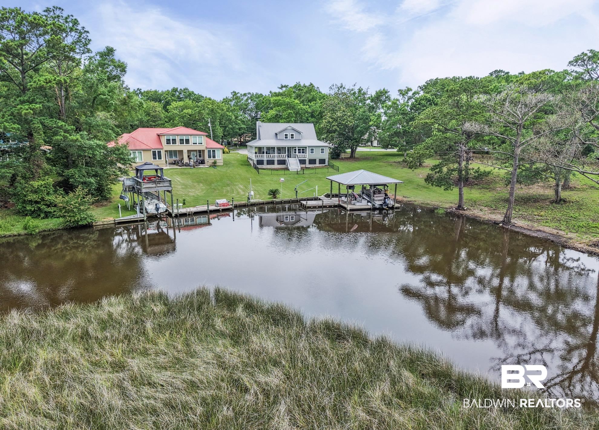 12171 Marguerite Drive Coden, AL 36523 - Photo 35 of 44 Waterfront property with extensive frontage, a private boat lift, and a covered dock