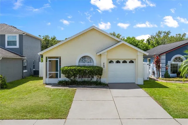 a view of a house with a yard