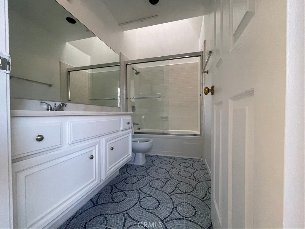16 Wellesley Irvine, CA 92612 - Photo 16 of 25 a spacious bathroom with a double vanity sink toilet mirror and shower
