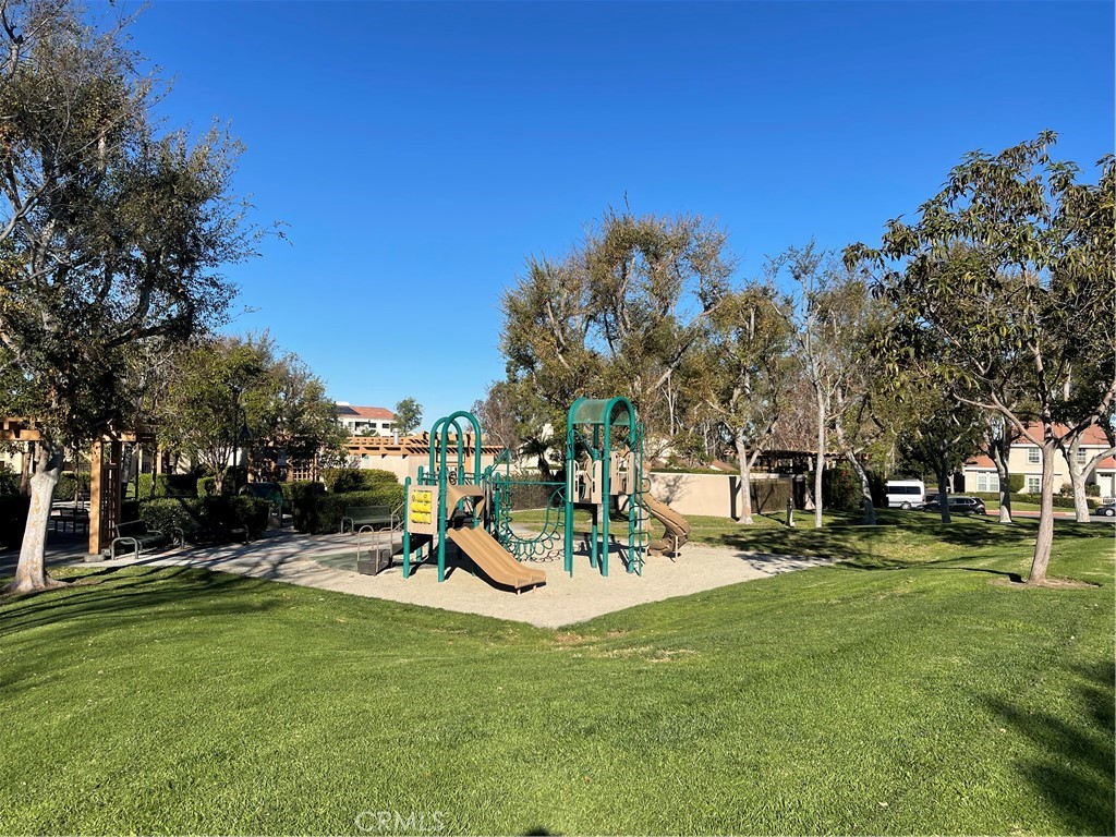 16 Wellesley Irvine, CA 92612 - Photo 21 of 25 a view of a park with swings and slides