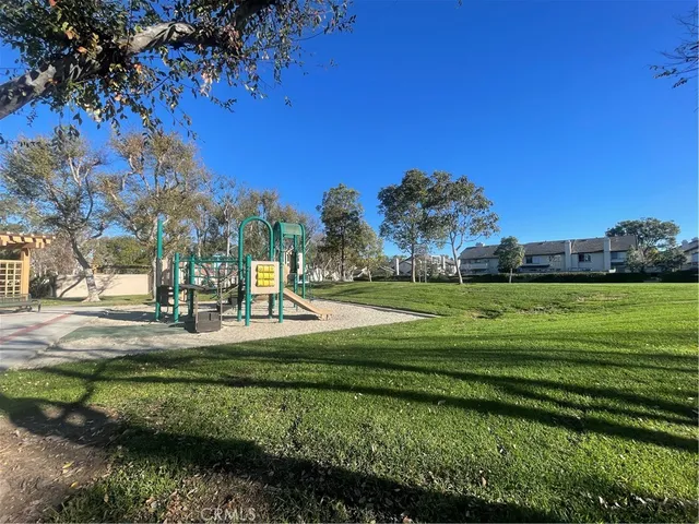 a view of a park with large trees