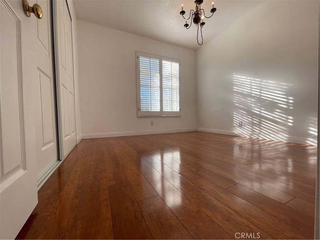 16 Wellesley Irvine, CA 92612 - Photo 7 of 25 a view of empty room with wooden floor and fan