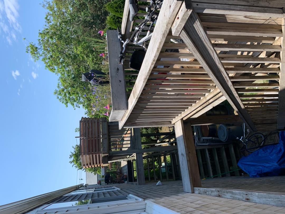 5 Salros Road Nantucket, MA 02554 - Photo 17 of 24 a view of a balcony with two chairs and a table