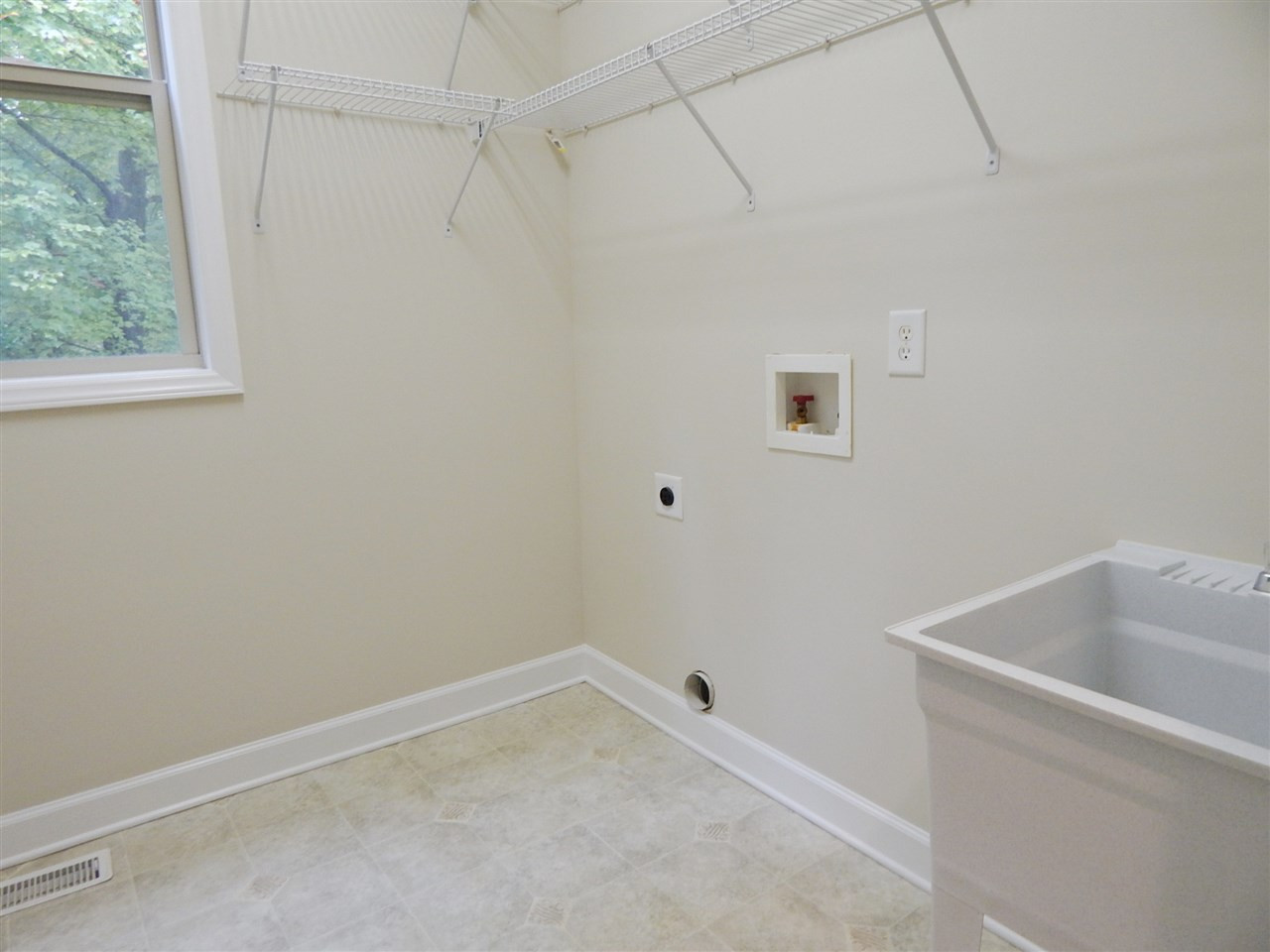 1424 Antiquity Avenue Raleigh, NC 27613 - Photo 18 of 25 1st floor laundry with wash sink