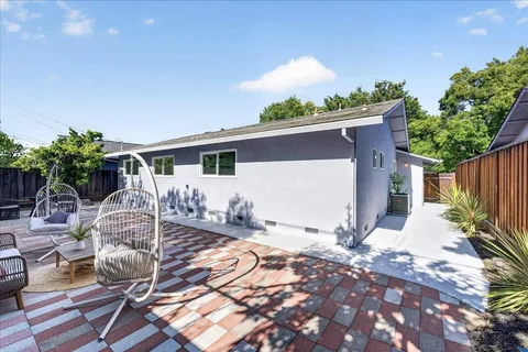 a front view of house with yard and seating space