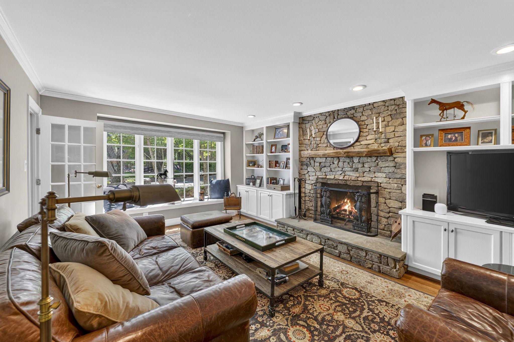 23559 Parsons Road Middleburg, VA 20117 - Photo 26 of 75 Den with stone fireplace and built in bookshelves