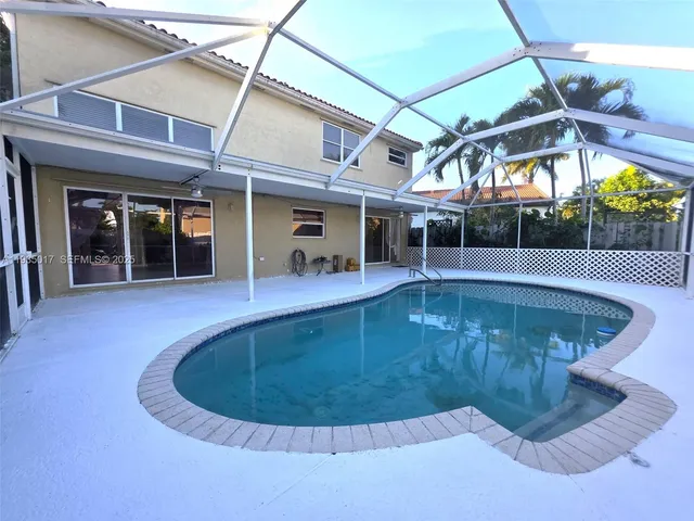 a view of a swimming pool with a patio