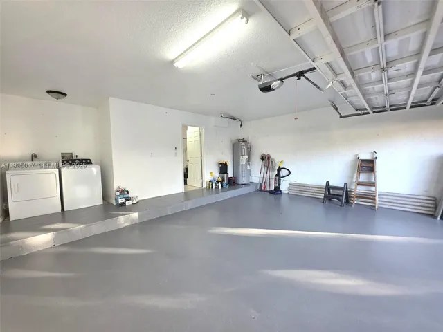 a room with furniture and a chandelier