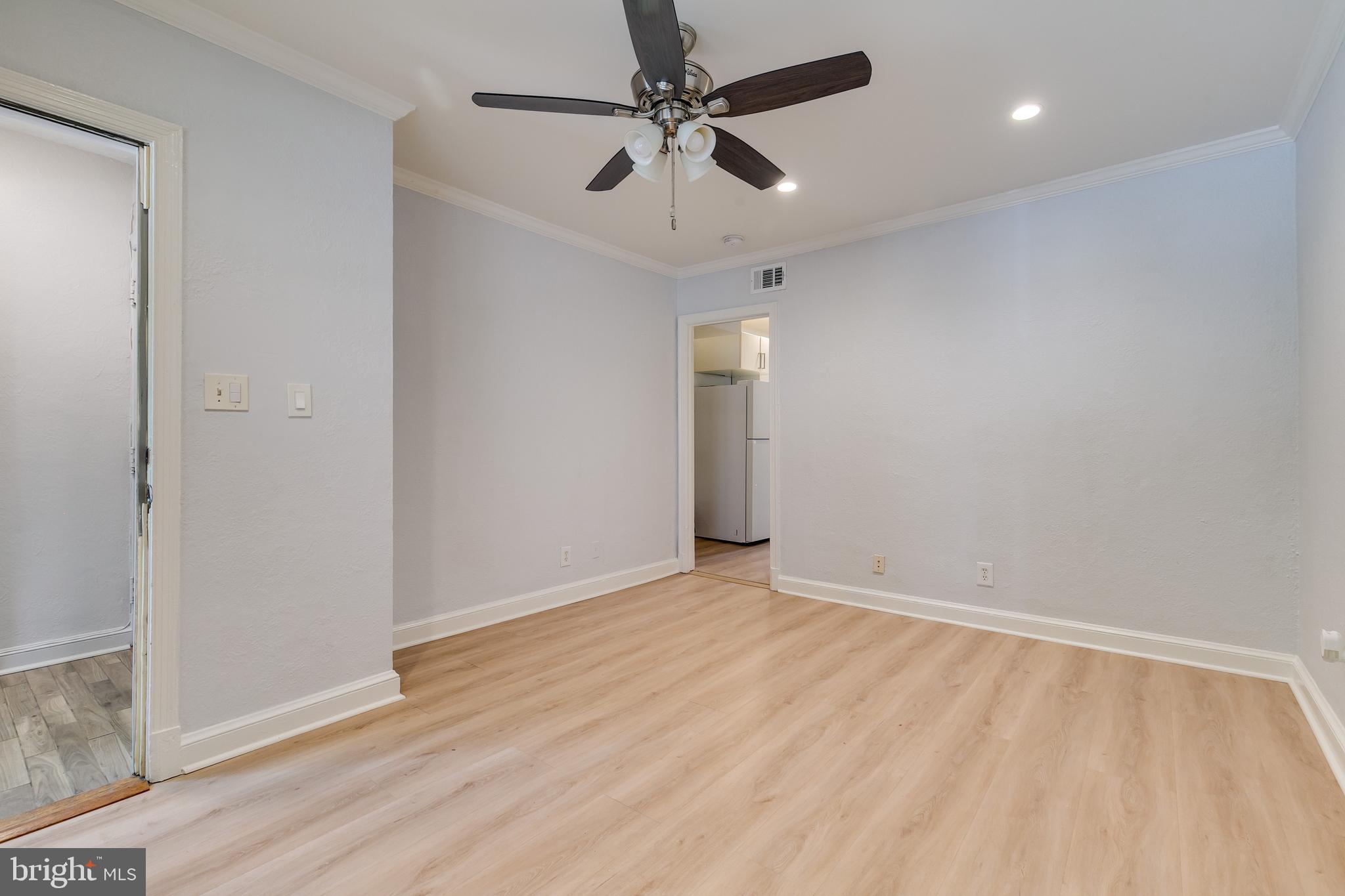 118 P Street Southwest Washington, DC 20024 - Photo 2 of 23 wooden floor in an empty room with a window
