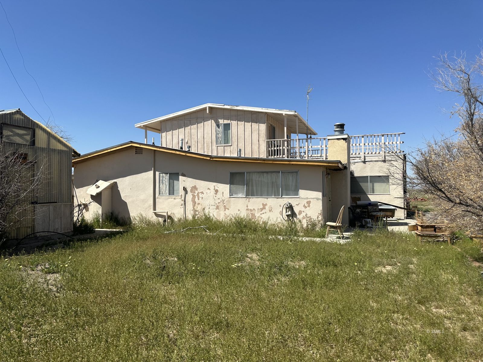 2511 Calvert Boulevard Ridgecrest, CA 93555 - Photo 28 of 41 a view of a house with a yard