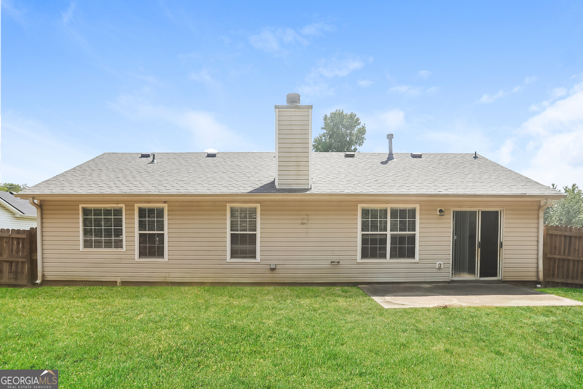125 Waters Edge Drive Locust Grove, GA 30248 - Photo 14 of 16 a front view of a house with a garden