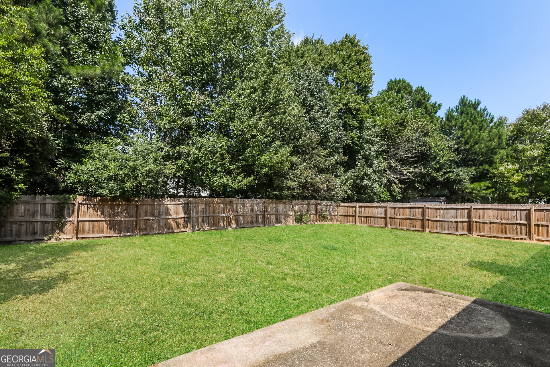125 Waters Edge Drive Locust Grove, GA 30248 - Photo 15 of 16 a view of a backyard with a slide