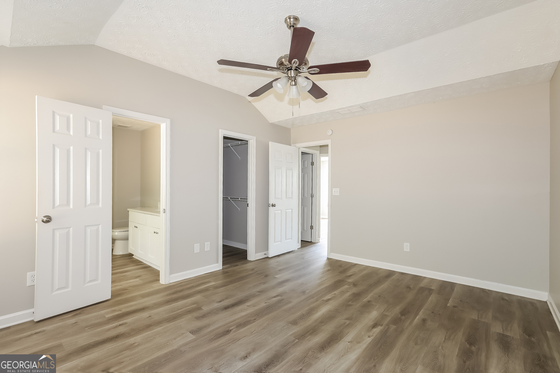 125 Waters Edge Drive Locust Grove, GA 30248 - Photo 8 of 16 wooden floor in an empty room
