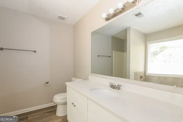 a bathroom with a sink and a toilet