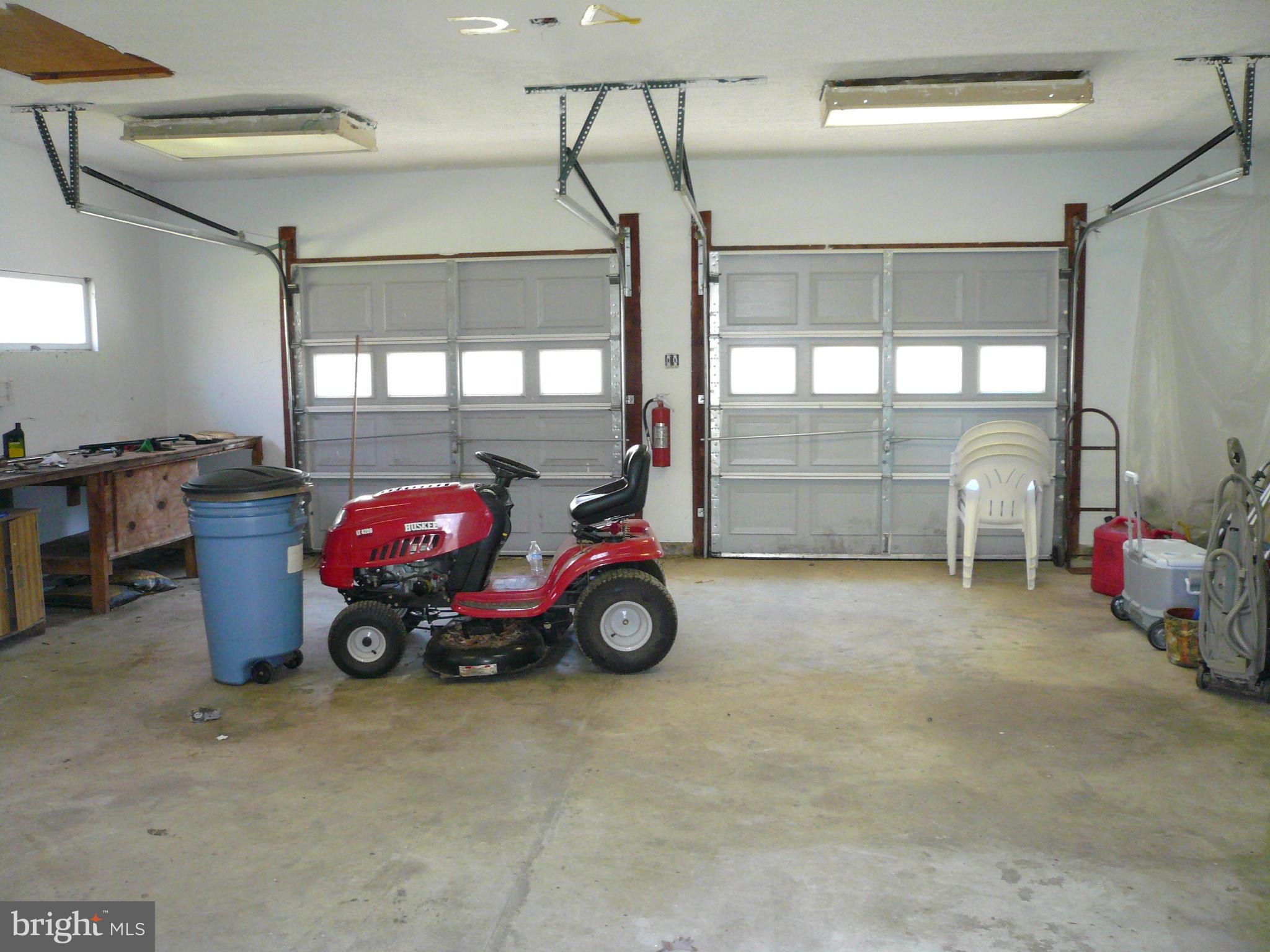 16801 Boot Hill Road Accokeek, MD 20607 - Photo 22 of 30 a car is parked in a garage