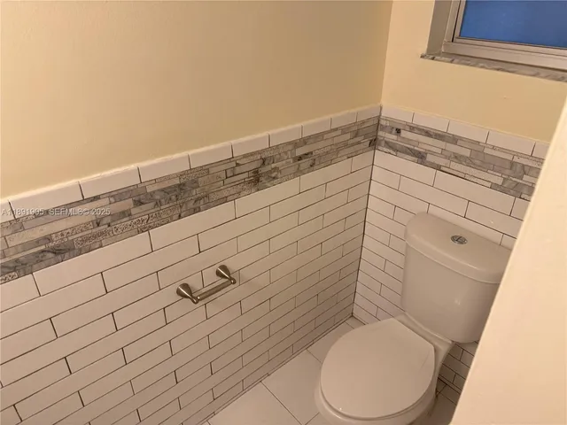 a utility room with washer and dryer