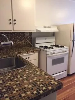 a kitchen with a stove and a sink