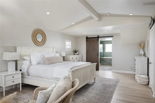 a bedroom with a bed and a lamp